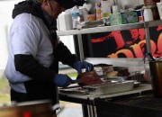 Chef Eric Dively, slices some beef, at BABBQ's traveling big rig
