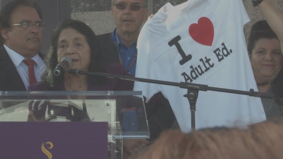 Dolores Huerta circulates a petition in favor of adult education at her 82nd birthday party.